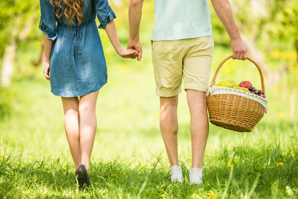 Young beautiful couple dressed casual having picnic in summer park. - 写真・画像