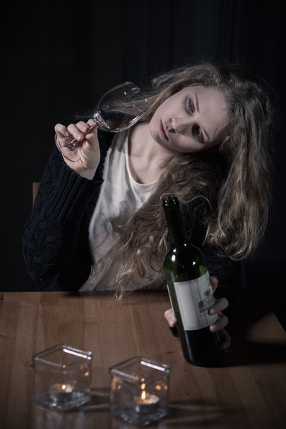Woman with problems drinking wine - 写真・画像