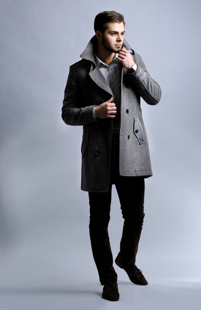 Young man in coat  - Fotó, kép