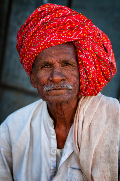 PUSHKAR, INDIA - MARCH 03, 2013: Undefined man with mustache in colourful turban portrait - Fotó, kép