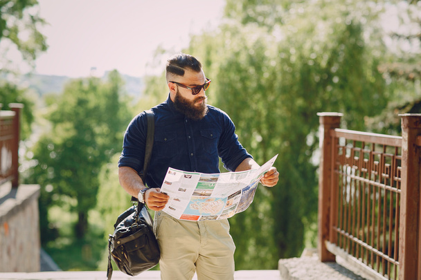 bearded man travels with map - Valokuva, kuva