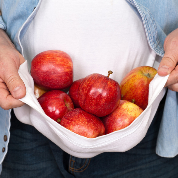Man holding Freshly Picked Apples
 - Фото, изображение