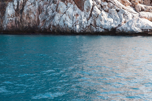 Blue sea and rocky mountain beach - Fotó, kép