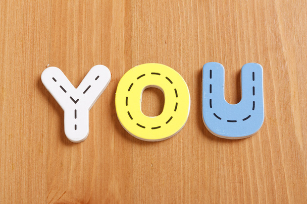 YOU, spell by woody puzzle letters with woody background - Fotoğraf, Görsel