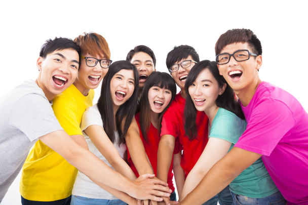 Группа молодых людей с руками вместе
 - Фото, изображение