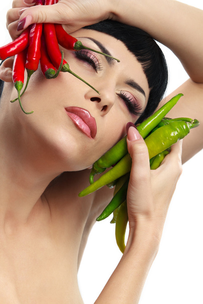 Lady holding hot chilli peppers - Fotoğraf, Görsel