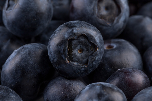 Blueberries on stone plate background - Foto, Imagen