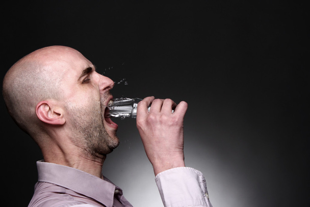 Man drink with splash vodka, water - Fotó, kép