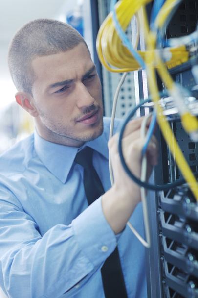 Businessman with laptop in network server room - Foto, immagini
