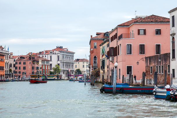 VENICE, ITALY - on APRIL 30, 2015. Old houses ashore Grand channel (Canal Grande). The grand channel is the main transport artery of Venice and its most known channel - Φωτογραφία, εικόνα