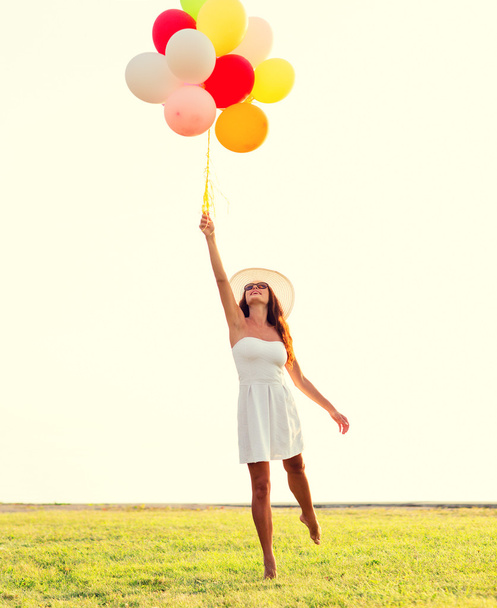 smiling young woman in sunglasses with balloons - Fotoğraf, Görsel
