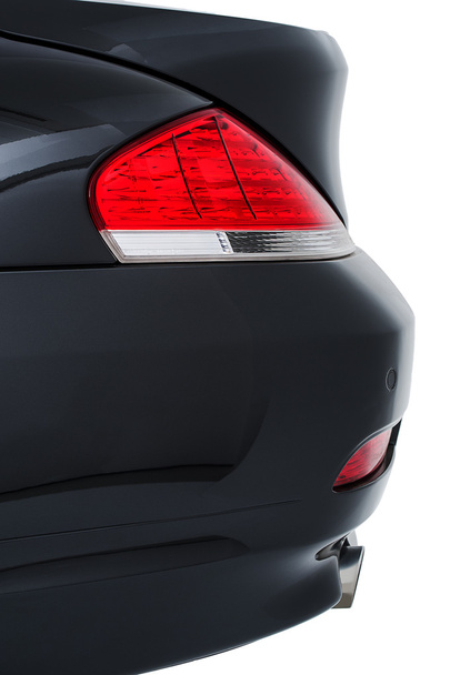 Задний фонарь современного чёрного автомобиля
 - Фото, изображение