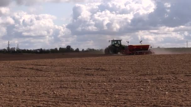 Tractor fertilizer prepare soil in field. Planting crops - Footage, Video