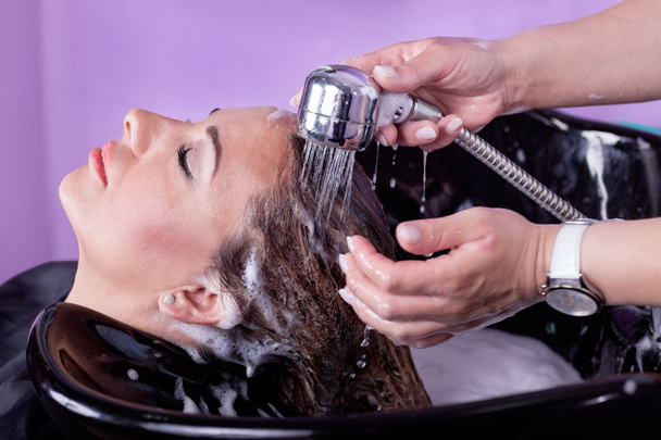 young woman at hairdresser wash hair - Фото, зображення