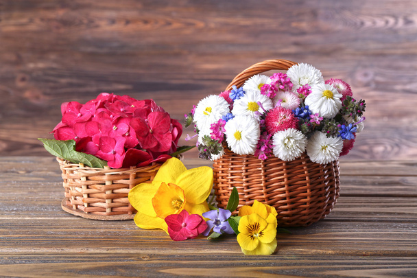 Beautiful spring flowers on wooden background - Fotografie, Obrázek