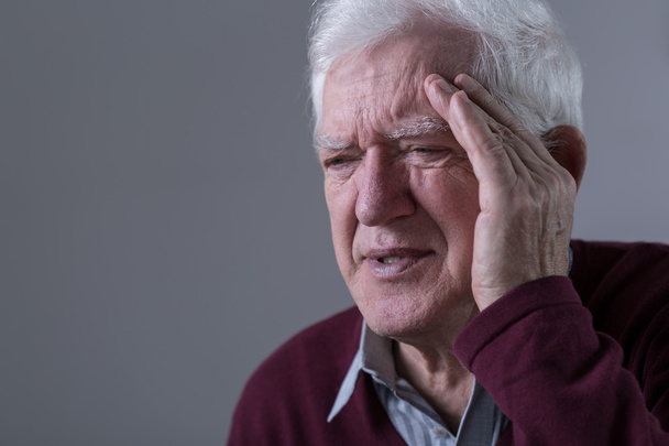 Old man has headache - Foto, Bild