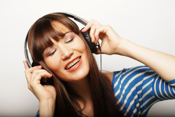 Young happy woman with headphones - Fotoğraf, Görsel