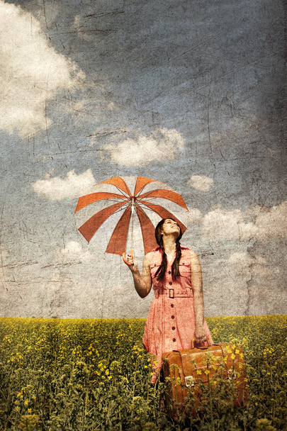 Brunette enchantress with umbrella and suitcase - Valokuva, kuva