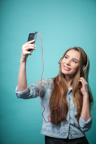 Cheerful Hipster woman with headphones and mobile phone - Fotografie, Obrázek