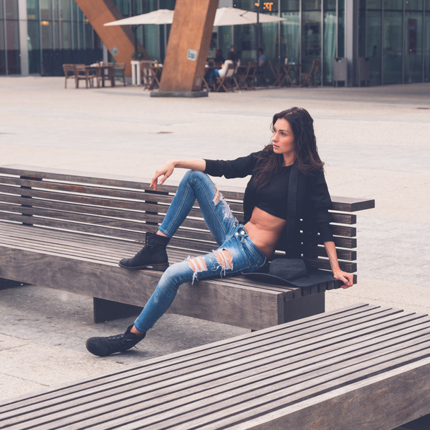 Beautiful girl posing on a bench - Zdjęcie, obraz