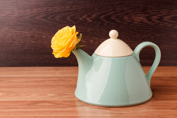 Light blue teapot with flowers - Zdjęcie, obraz