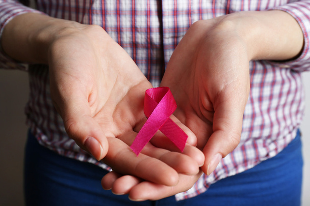 Female hands with pink ribbon - Photo, Image