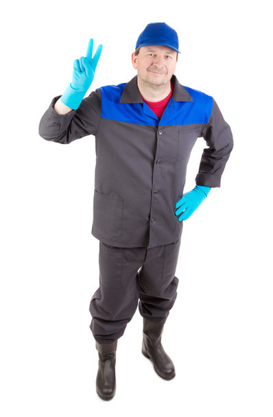 Worker in blue working suit. - Foto, afbeelding