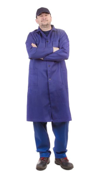 Worker in blue coat. - Zdjęcie, obraz
