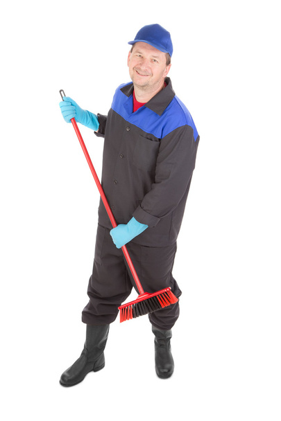 Worker sweeping floor. - Φωτογραφία, εικόνα