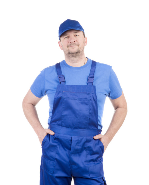 Man in blue overalls. - Foto, imagen