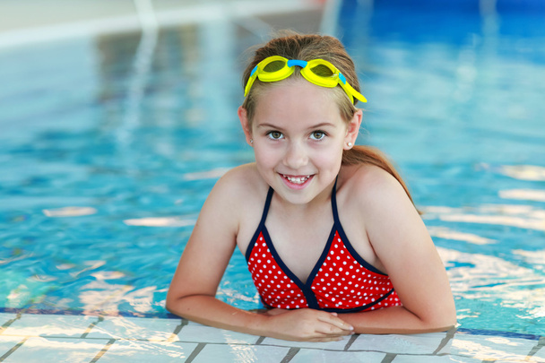 Girl with goggles in swimming pool - Photo, Image
