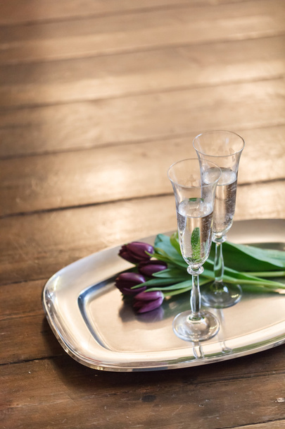 Glasses of champagne and flowers - Фото, зображення
