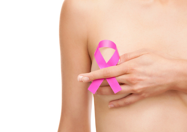 Woman with a breast cancer awareness ribbon - Foto, Imagem