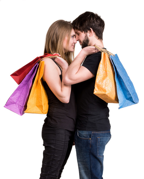 Happy couple with shopping bags - 写真・画像