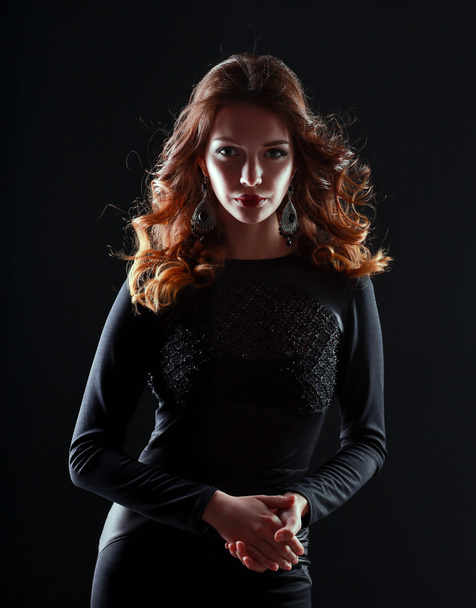 Portrait of beautiful brunette woman in black dress - Foto, imagen