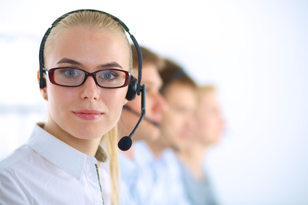 Attractive positive young businesspeople and colleagues in a call center office - Fotó, kép
