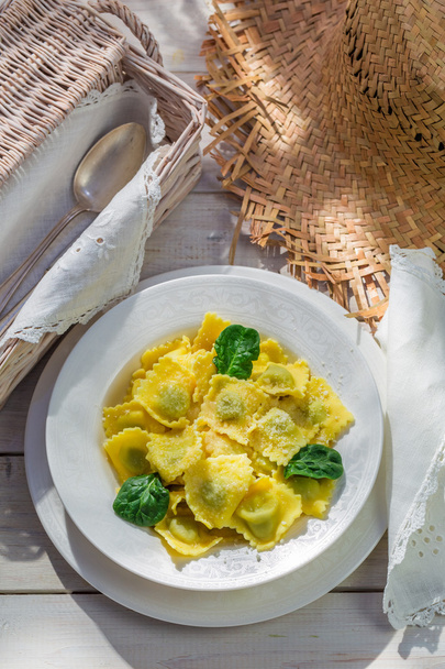 Ravioli with parmesan in the rustic kitchen - Foto, afbeelding