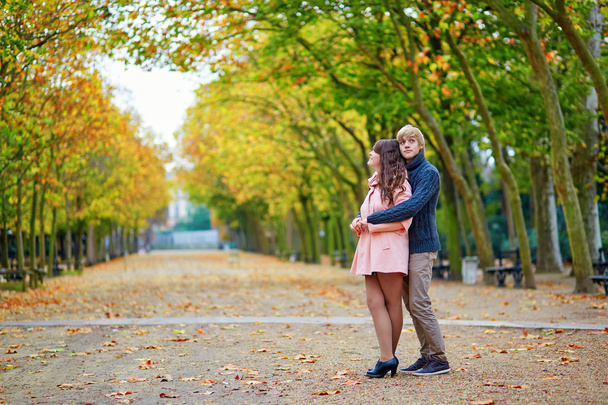 Young dating couple in Paris on a bright fall day - Photo, image