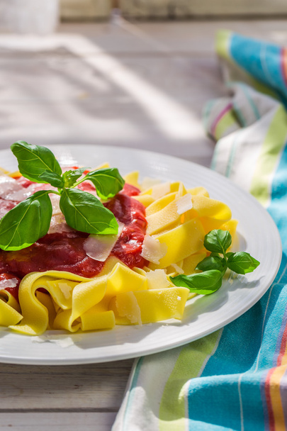 Delicious pappardelle pasta with tomato sauce and parmesan - Zdjęcie, obraz