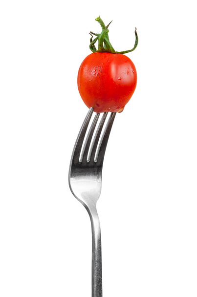 Tomate cereza en un tenedor
 - Foto, Imagen