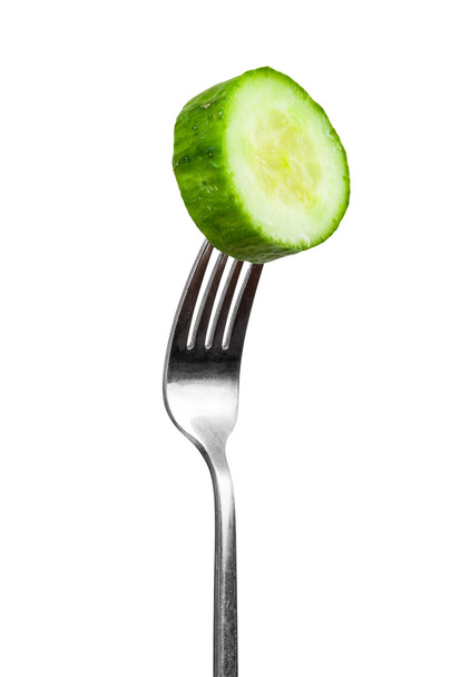 Slice of cucumber on a fork - Photo, Image
