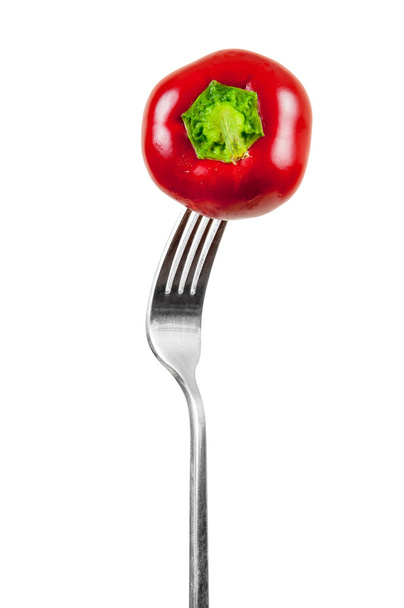 Piccolo pepe rosso su una forchetta
 - Foto, immagini