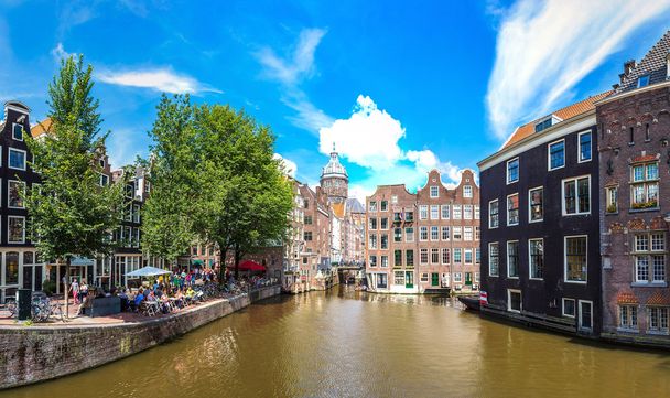 Canal and St. Nicolas Church in Amsterdam - Photo, Image