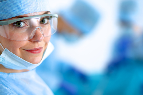 Female surgery in the operating room - Foto, imagen