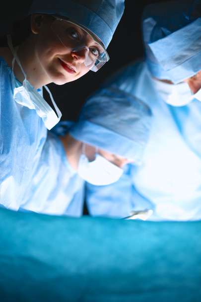 Surgery team in the operating room - Fotoğraf, Görsel