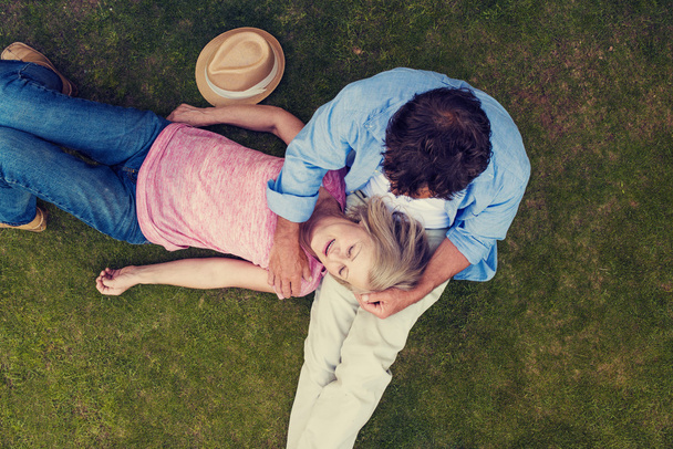 senior couple lying on a grass - Photo, image