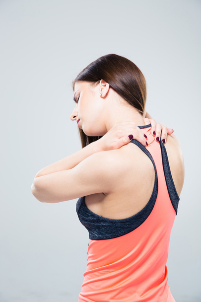 Sporty woman having back pain - Foto, Imagem