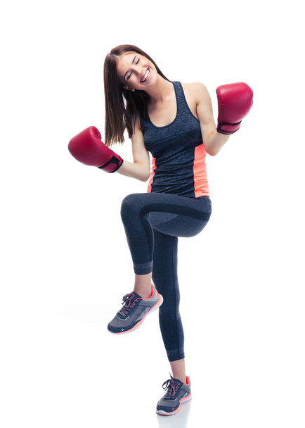 Sporty woman celebrating her victory in boxing gloves - Foto, Bild