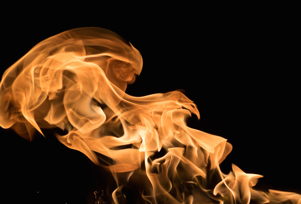 Burning flame on black background - Foto, afbeelding