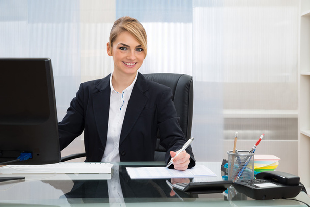 Businesswoman Working In Office - Фото, изображение